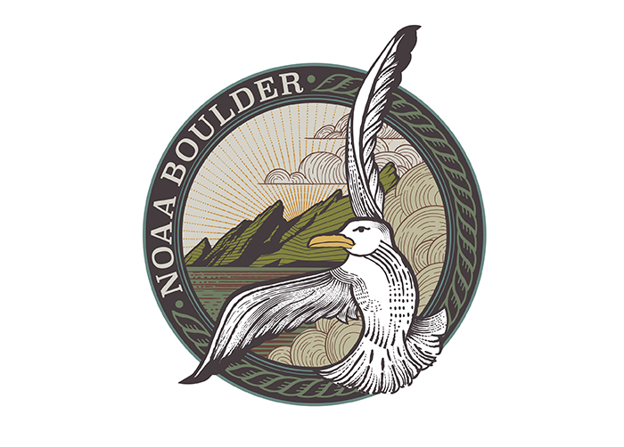 Logo with a drawing of a seagul flying over water near mountains.